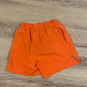 Orange BCG men’s running shorts.